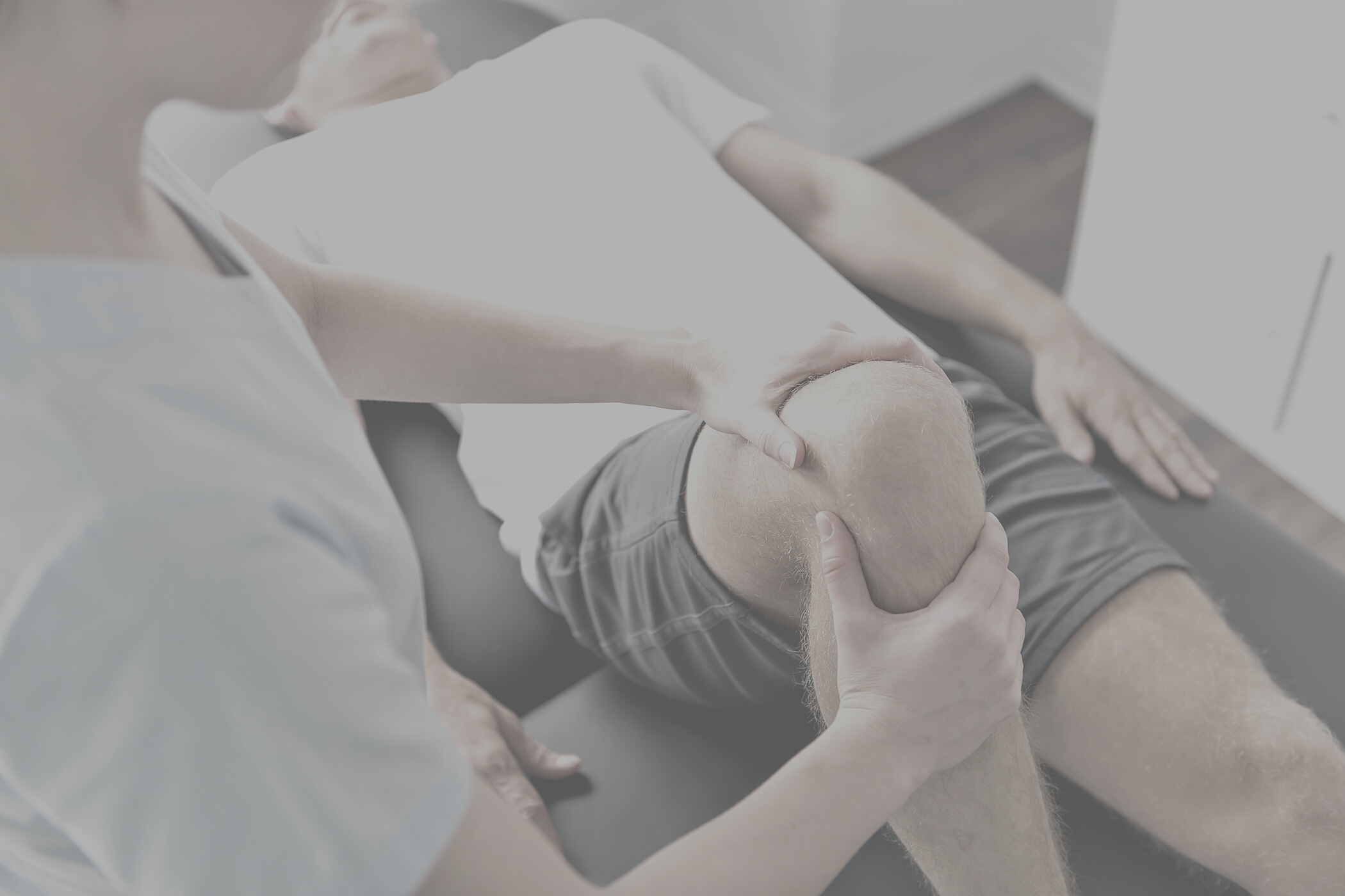 Patient at the physiotherapy doing physical exercises with his therapist